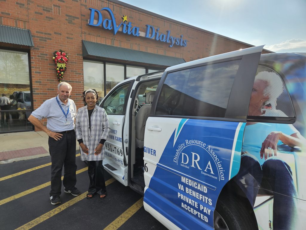 Allen and Christina next to van